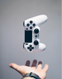 A hand with a Gaming Console